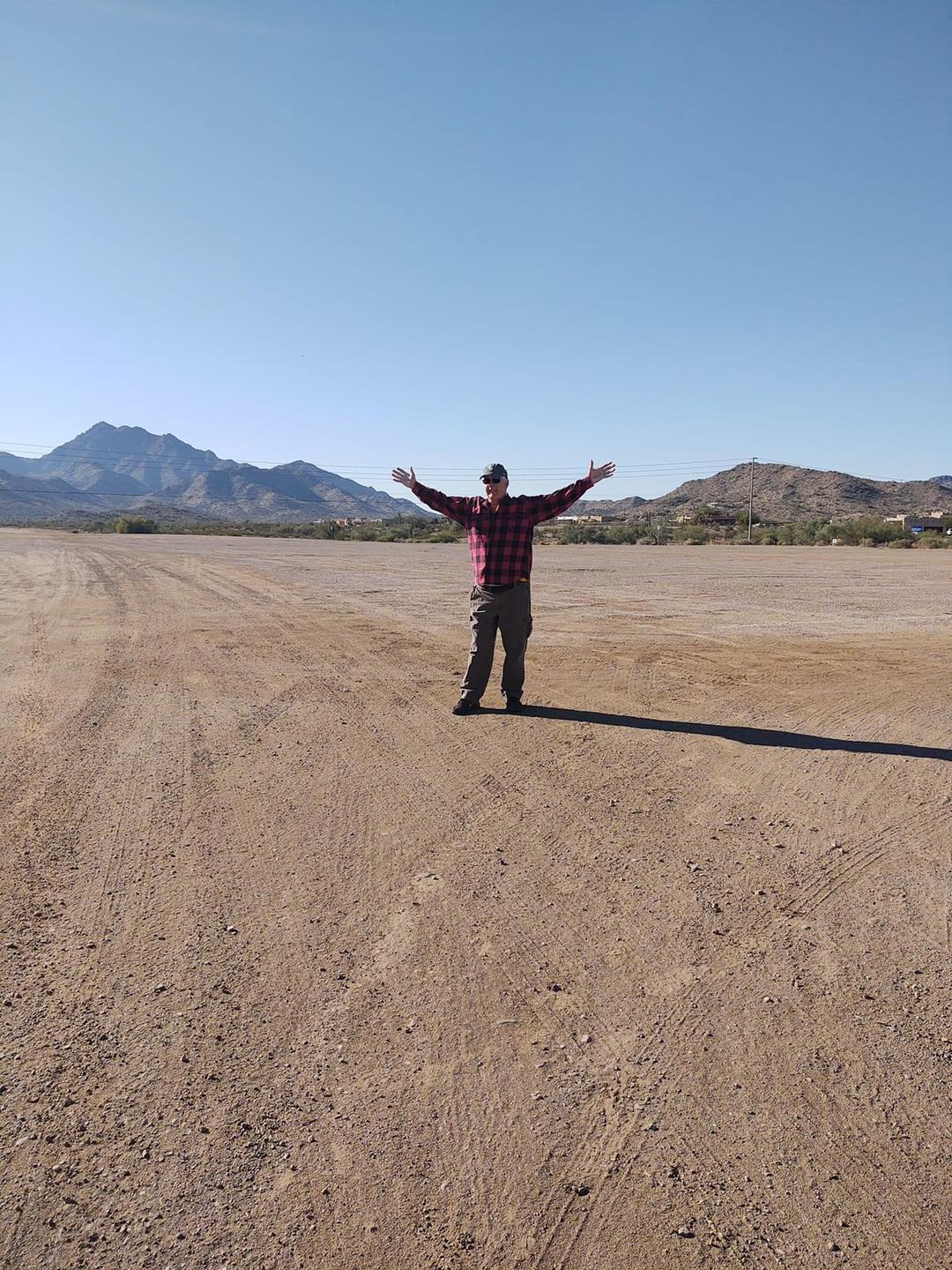 Eager volunteer for site crew on the land before set-up.