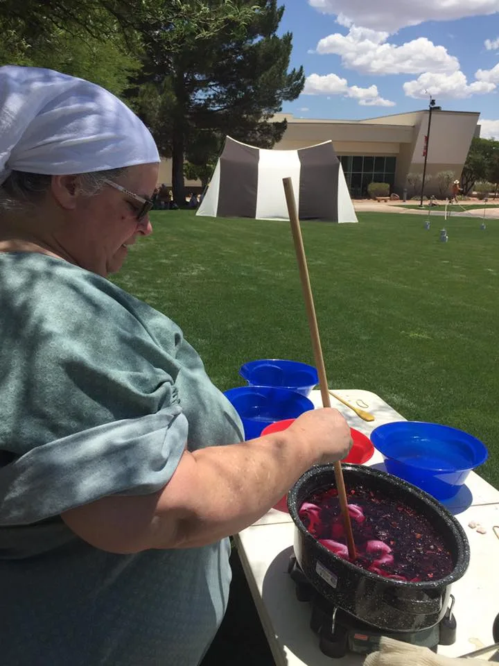 Mistress Nastasi'a demonstrating dyeing in vats