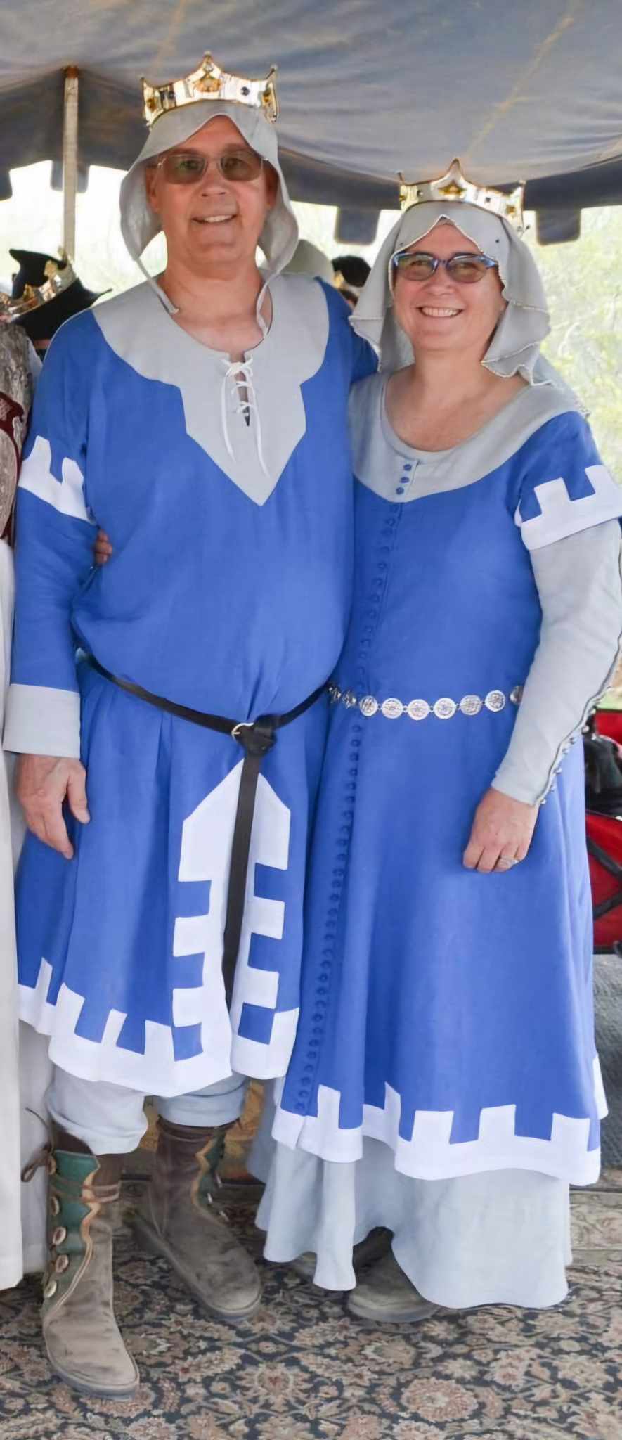 Baron Johan and Baroness Catyln Standing together in lovely blue garb with a white zipper photo by Lady Honor