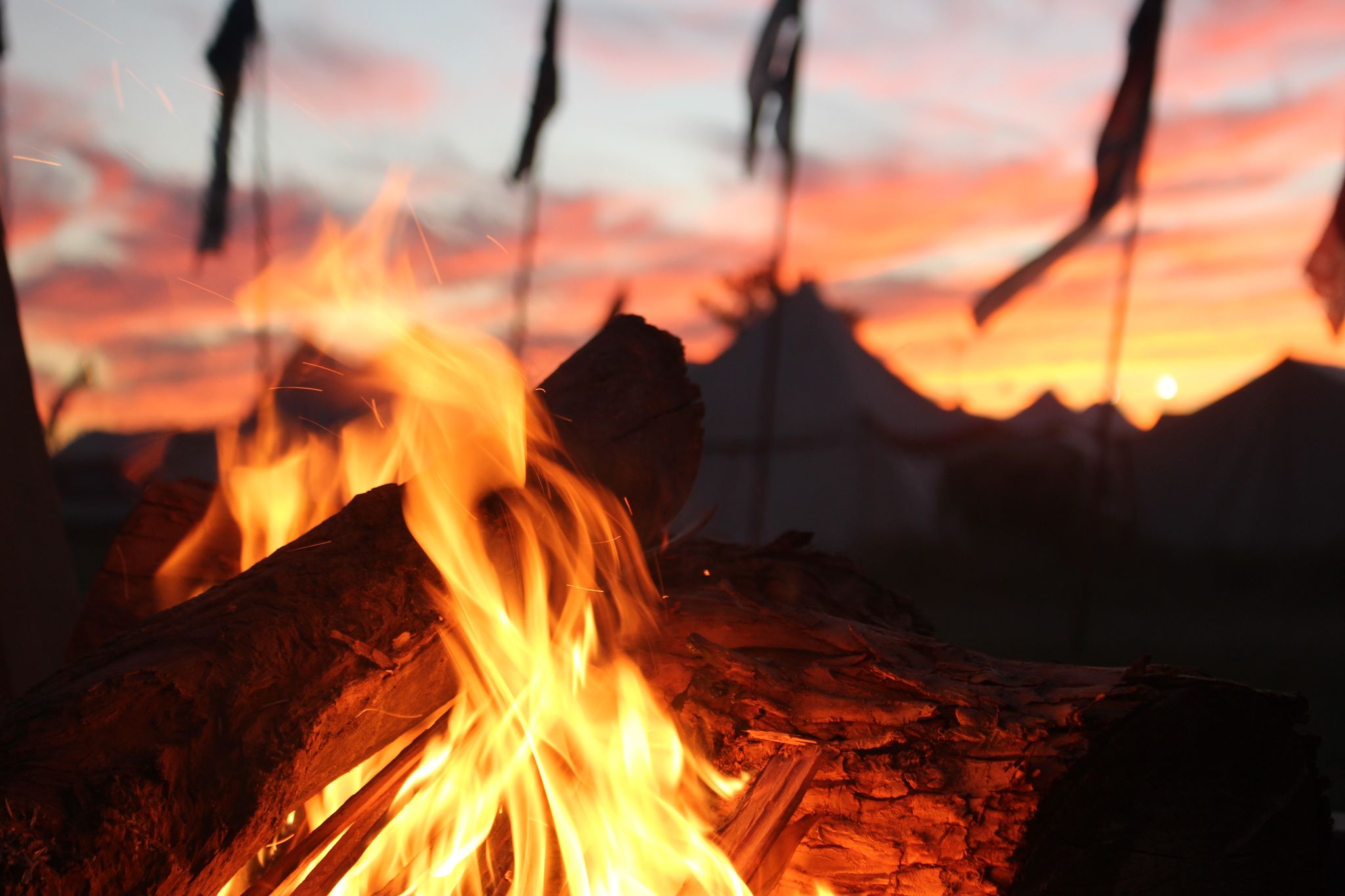 Hearing the town crier exclaim the latest news by the camp fire.